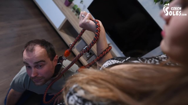 Foot Goddess Dominates Her Leashed Slave with High Heels and Sole Worship