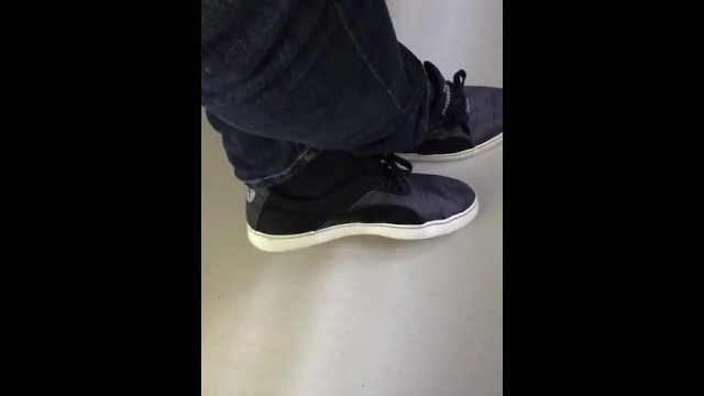 Shoeplay with Puma Sneakers and Black Socks by a Male at Work